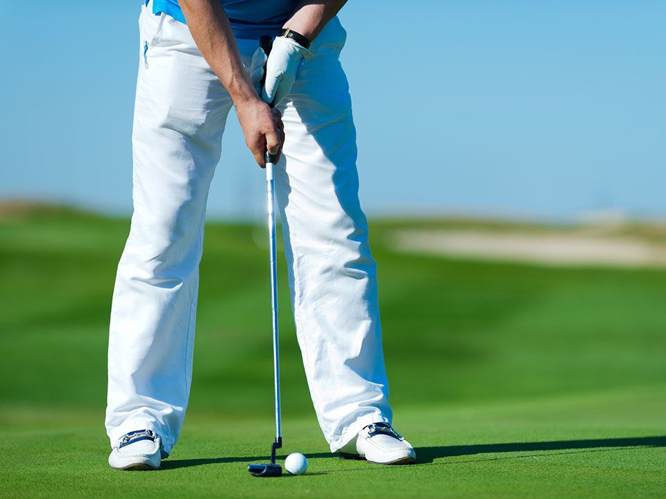 A men playing golf